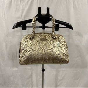 Kate Spade Metallic Gold Daisy Cut-out purse with dust bag